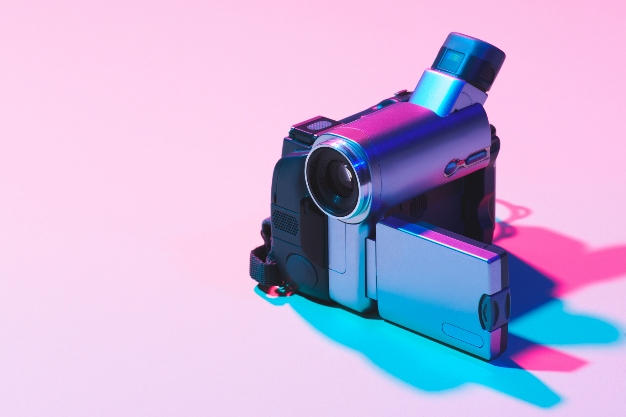 Video camera on pink and blue background