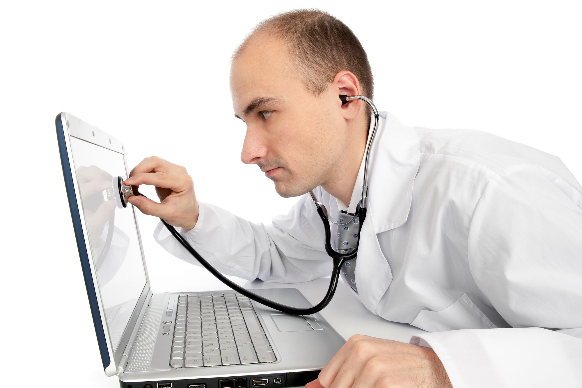 Doctor with stethoscope checking a laptop's health