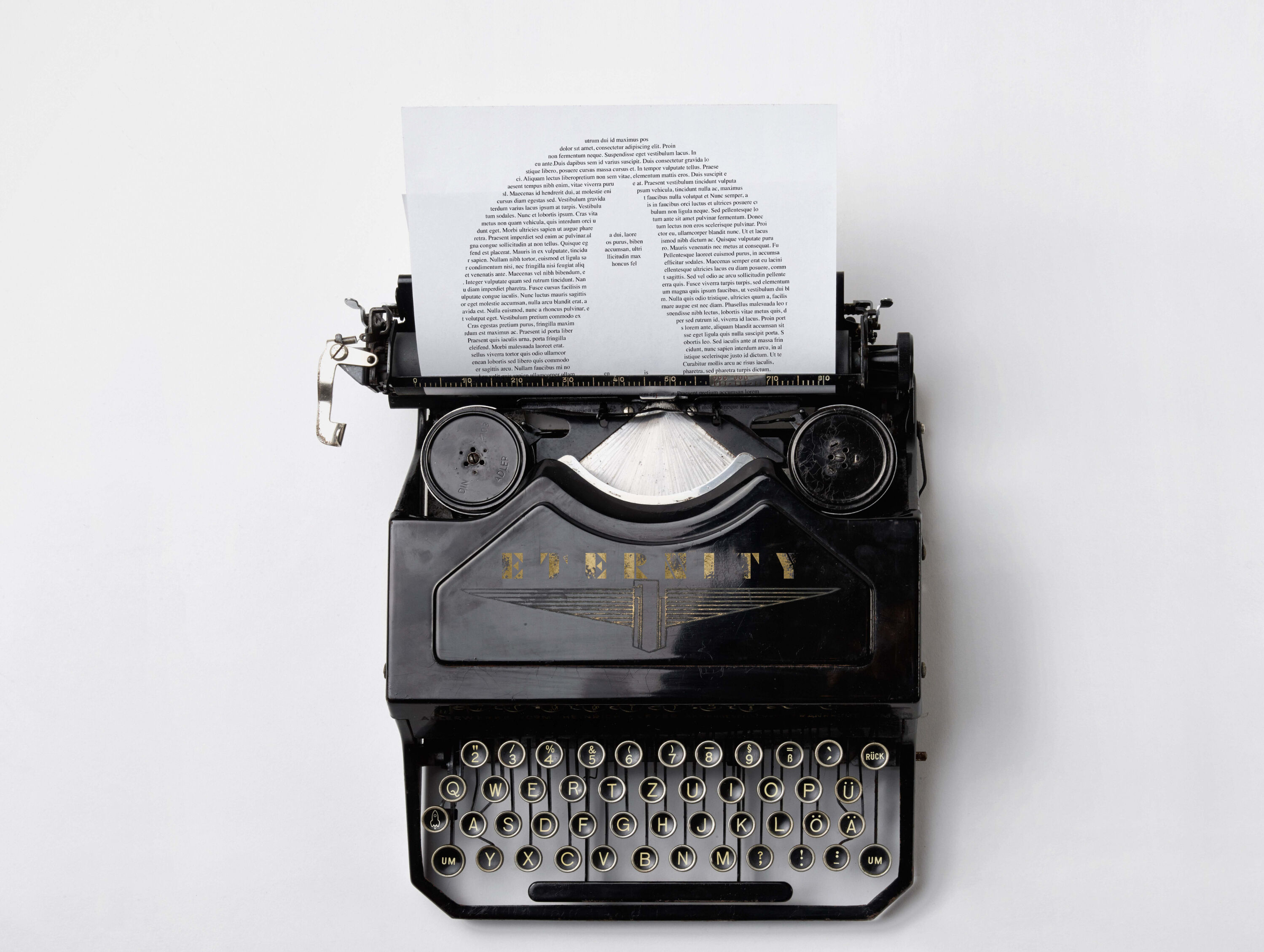 Typewriter with Eternity logo