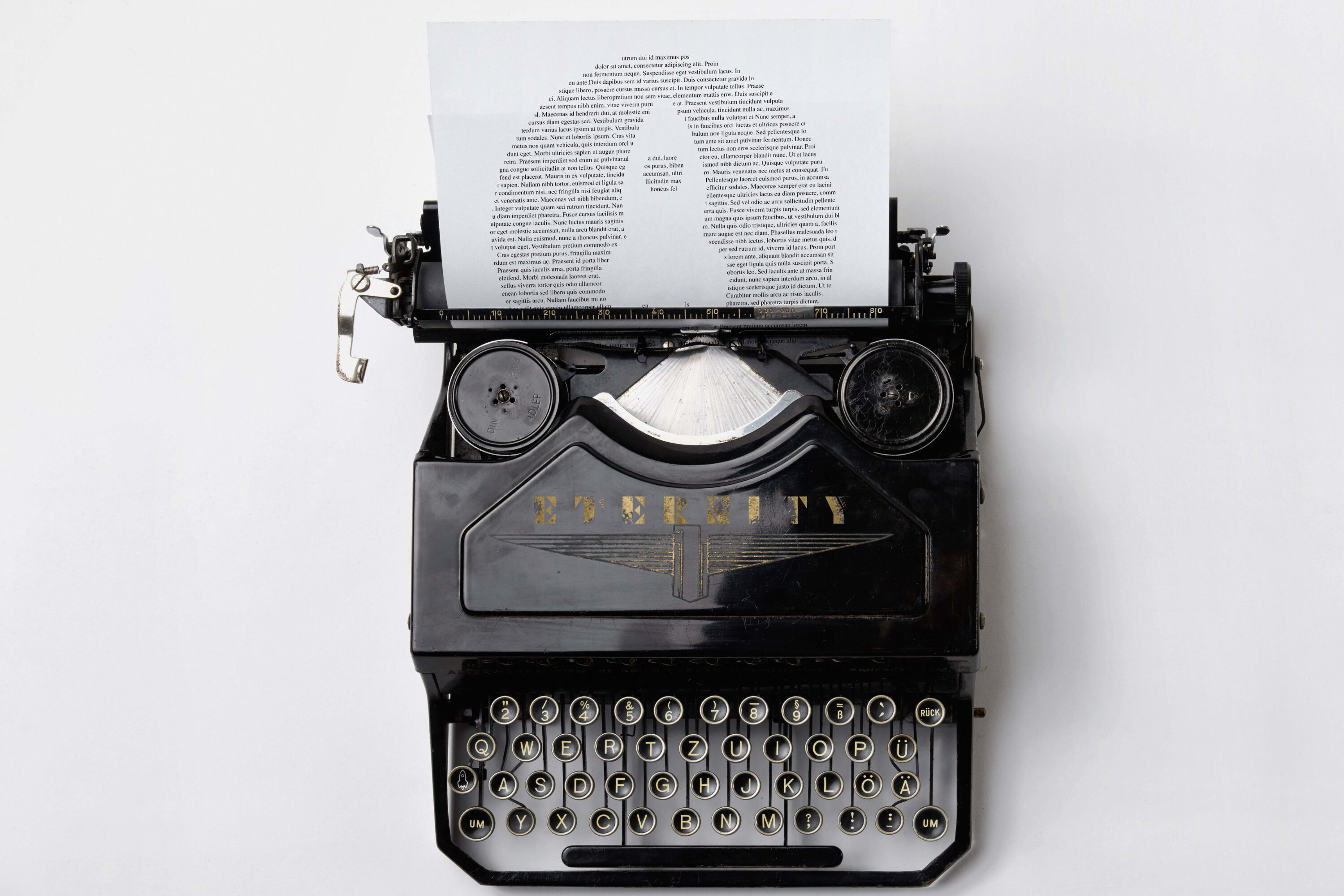 Typewriter with Eternity logo