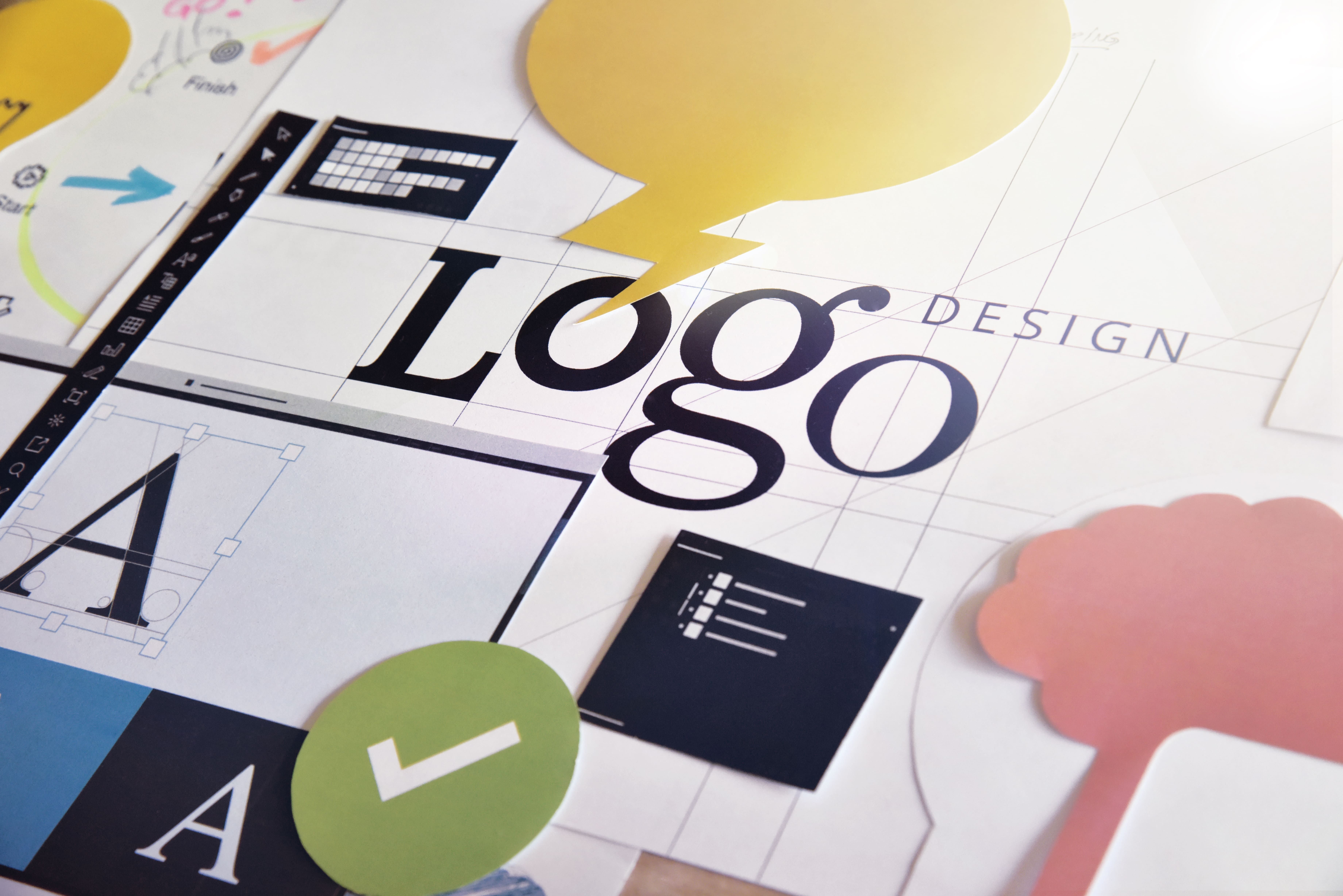 Logo design elemtns cutout on paper