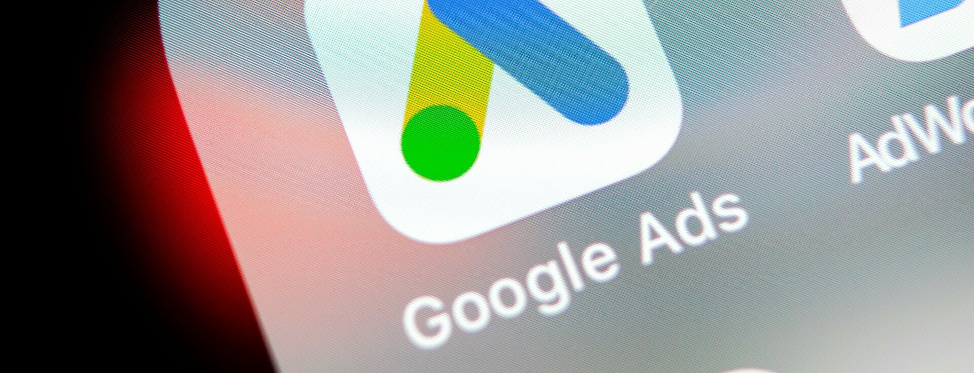 Close-up of the Google Ads app icon on a smartphone screen