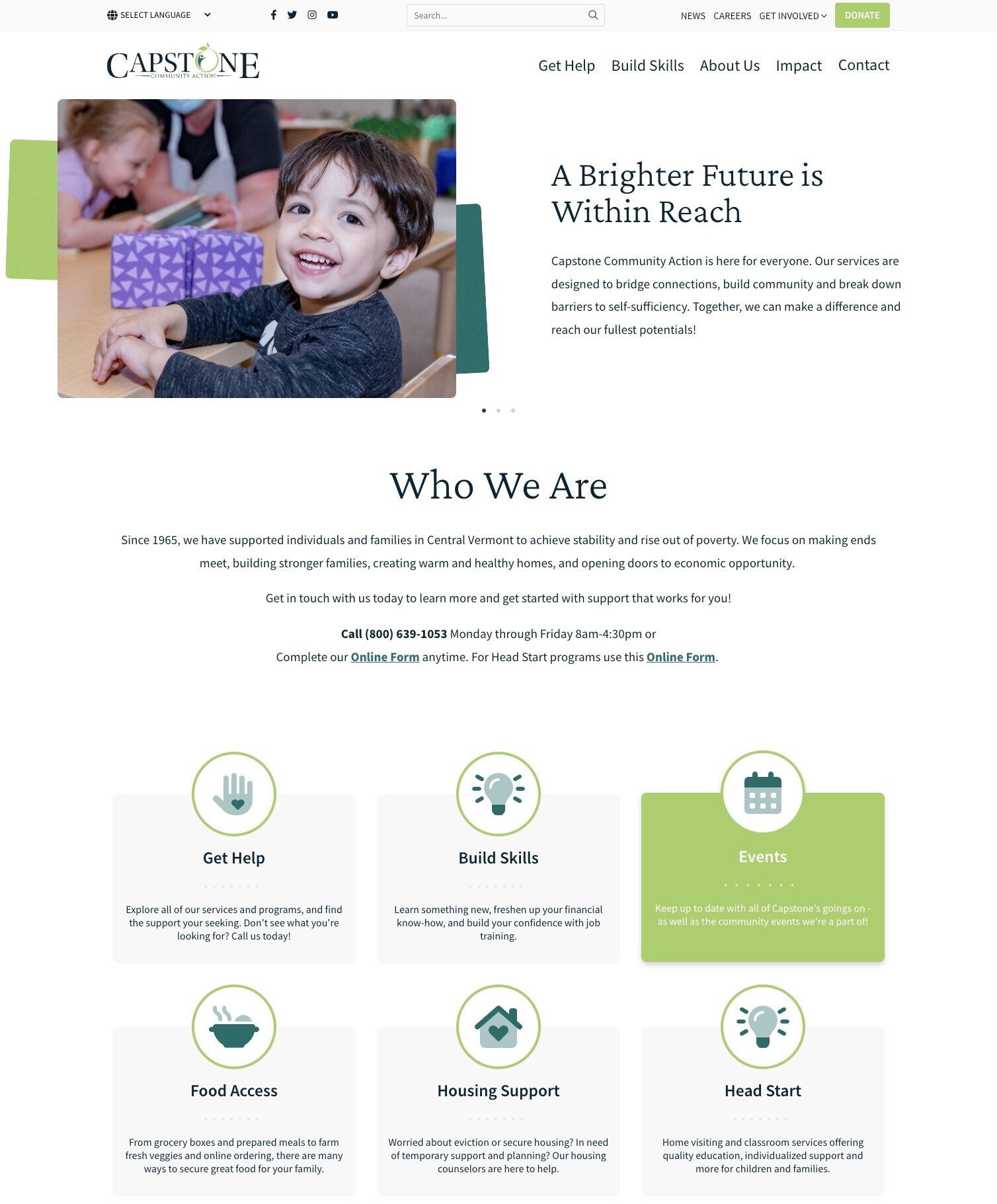 Smiling child at a table with educational materials, promoting community support services.