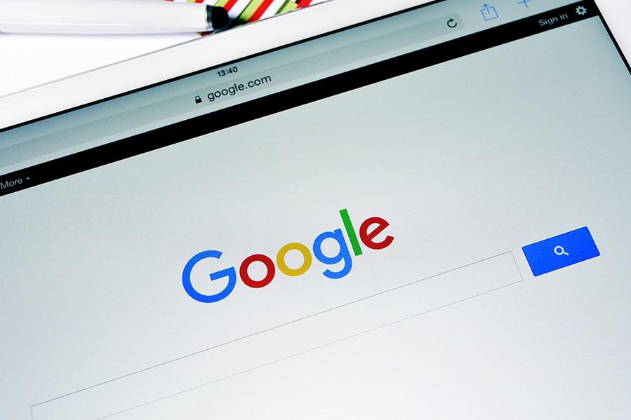 Google homepage displayed on a tablet screen with a search bar