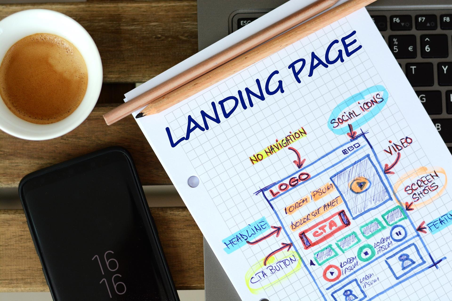 Sketch of a landing page layout with coffee and smartphone in view