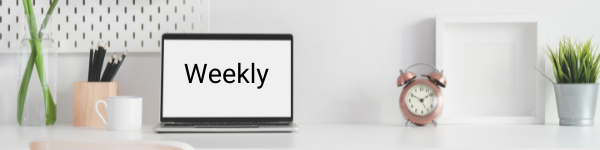 Laptop screen that says weekly