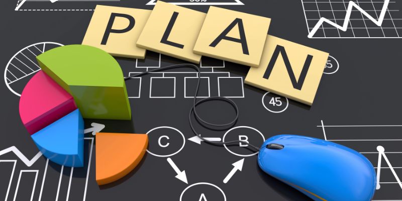 Colorful pie chart, mouse and PLAN letters on chalkboard with strategy diagrams.