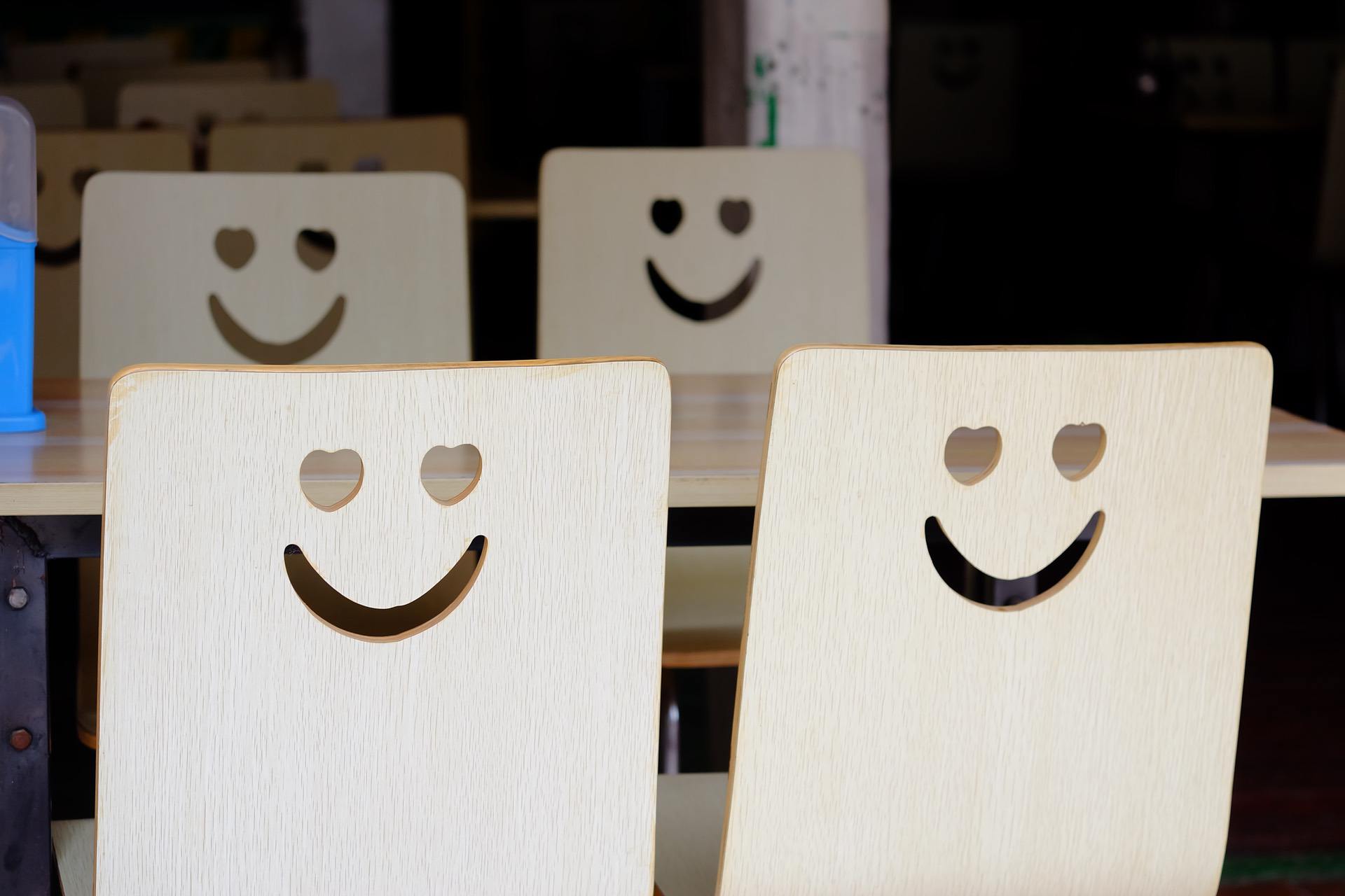 Wood cut-outs of the heart-eyes emoji