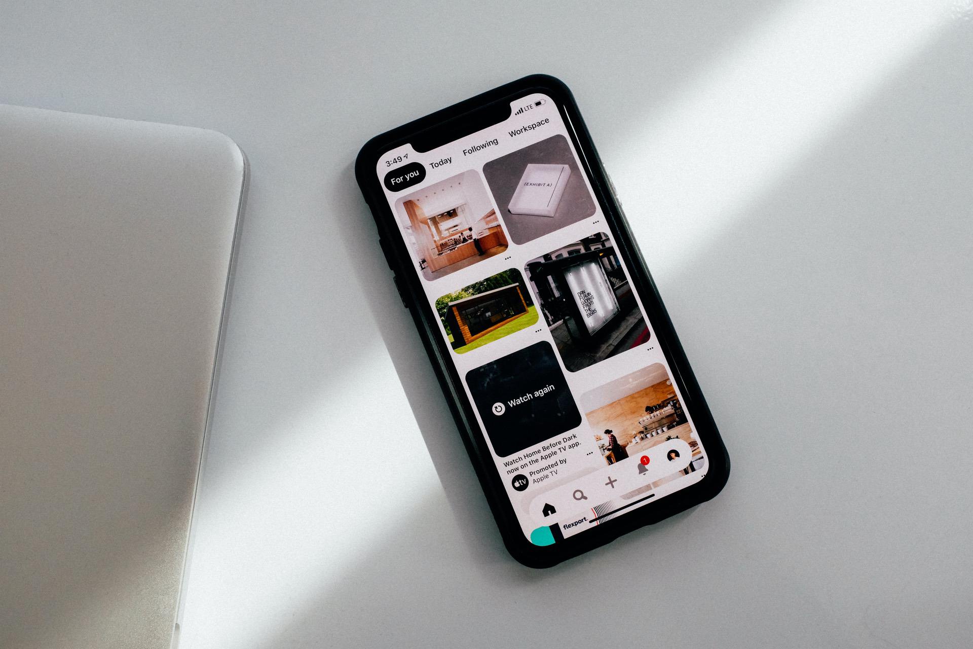 Phone with Pinterest open on the screen